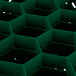 A close up of a green hexagonal grid on a green plastic container.