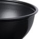 A close up of a Solo black wide sauce/portion cup.