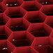 A red hexagonal Vollrath Traex glass rack with open rack extender.