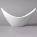 A white 10 Strawberry Street Whittier porcelain cradle bowl on a gray surface.