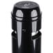 A black Rubbermaid cigarette receptacle with a white logo.
