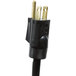 A black power cord with two gold plugs plugged into an APW Wyott stationary steam table.