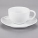 A 10 Strawberry Street white porcelain cup and saucer with a handle.