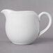 A 10 Strawberry Street Whittier white porcelain creamer with a handle.