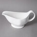 A white 10 Strawberry Street Whittier gravy boat with a white handle.