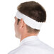 A man wearing a white Headsweats headband.