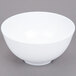 A white GET Water Lily melamine bowl on a gray surface.