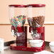 Two red Zevro dry food dispensers with cereal in them.