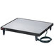 A black rectangular Hatco heated shelf on a table with a cord attached.