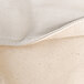 A close up of a cream and gray canvas fabric with white trim.