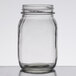 An American Metalcraft clear glass mason jar with a white lid on a table.