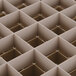 A Vollrath Traex beige glass rack with a grid of squares.