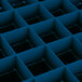 A blue plastic grid with square and rectangular compartments.