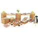 A Cal-Mil bamboo rectangular riser shelf on a table full of food.