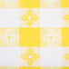 A yellow and white checkered fabric table cover.