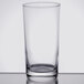 An Arcoroc clear beverage glass on a white background.