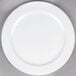 A Tuxton Alaska bright white china plate with a wide rim.