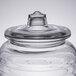 A Libbey clear glass barrel jar with a lid.