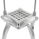 A stainless steel Nemco 1" square cut blade and holder assembly with metal legs and a grid on top.