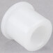 A close-up of a white plastic bushing.