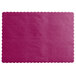 A wine colored paper placemat with scalloped edges.