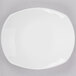 A Tuxton AlumaTux Pearl White china plate with a small rim.