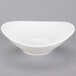 A Tuxton Pearl White China Bouillon bowl with a curved edge.