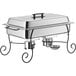 A Choice stainless steel full size chafer on a black wrought iron stand.
