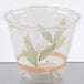 A Bare by Solo clear plastic cup with green leaves on it.