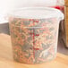 The translucent lid for a Cambro round polypropylene food storage container with pasta inside.