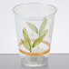 A clear plastic Bare by Solo individually-wrapped cup with green leaves.