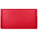 A red rectangular tray with a small hole in the middle.