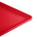 A red Cambro dietary tray with a corner.