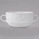 A Tuxton bright white china mug with two handles.