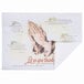 A close-up of a Hoffmaster Four Faiths paper placemat with a prayer and praying hands.