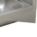 A stainless steel Advance Tabco wall bracket for a sink.