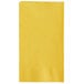 A yellow rectangular Choice paper dinner napkin with a white border.
