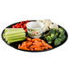 A WNA Comet black round catering tray with 6 compartments filled with vegetables and dip.