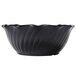 A close-up of a black Cambro swirl bowl with wavy lines.