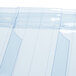 A close up of a clear plastic sheet with a few pieces of plastic.