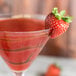 A Chef & Sommelier Cabernet martini glass with a strawberry on the rim.