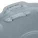 A close-up of a gray Rubbermaid lid with a handle.