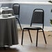 Lancaster Table & Seating Black Stackable Banquet Chair with 1" Padded Seat Main Thumbnail 1