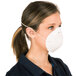 A woman wearing a Cordova General Purpose Nuisance Dust Mask.