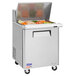 A Turbo Air stainless steel refrigerated sandwich prep table with food inside.