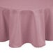 A pink Intedge 100% polyester round table cover on a table.