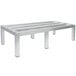 An Advance Tabco aluminum dunnage rack with four legs.