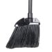 A close-up of a black Rubbermaid Lobby Broom with a black handle.