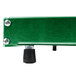 A close-up of a green rectangular Hatco Glo-Ray heated shelf with a black knob.