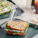 A sandwich in a Dart clear plastic hinged container.